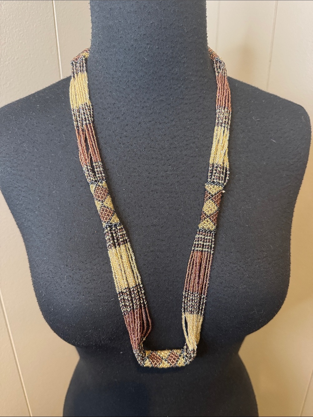 Alternating lattice tubes & strand seed bead infinity necklace. Aztec vibe.